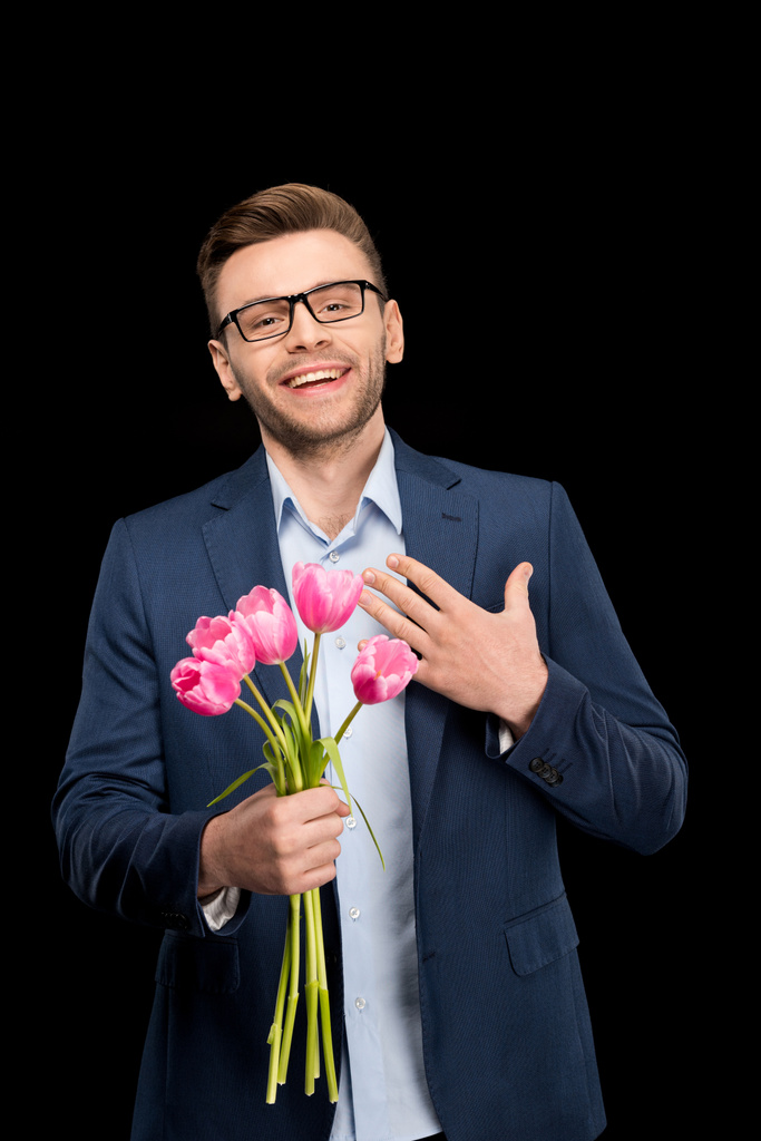 Hombre sosteniendo tulipanes
 - Foto, imagen