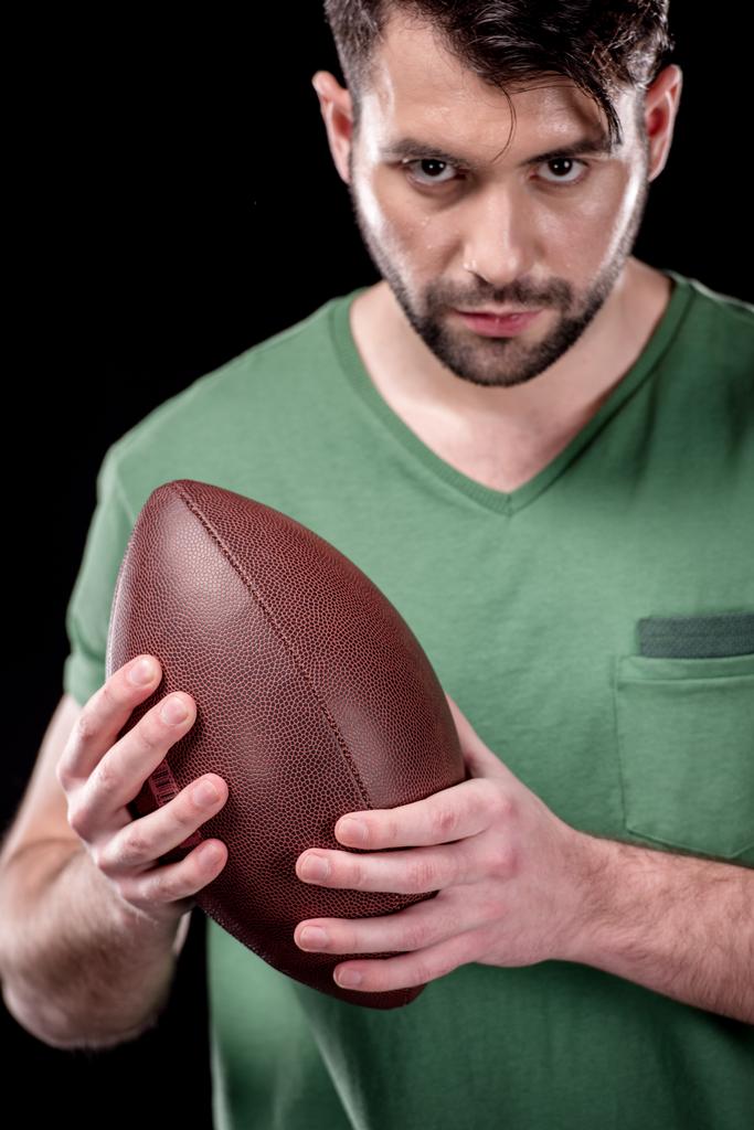 homem com bola de rugby
 - Foto, Imagem