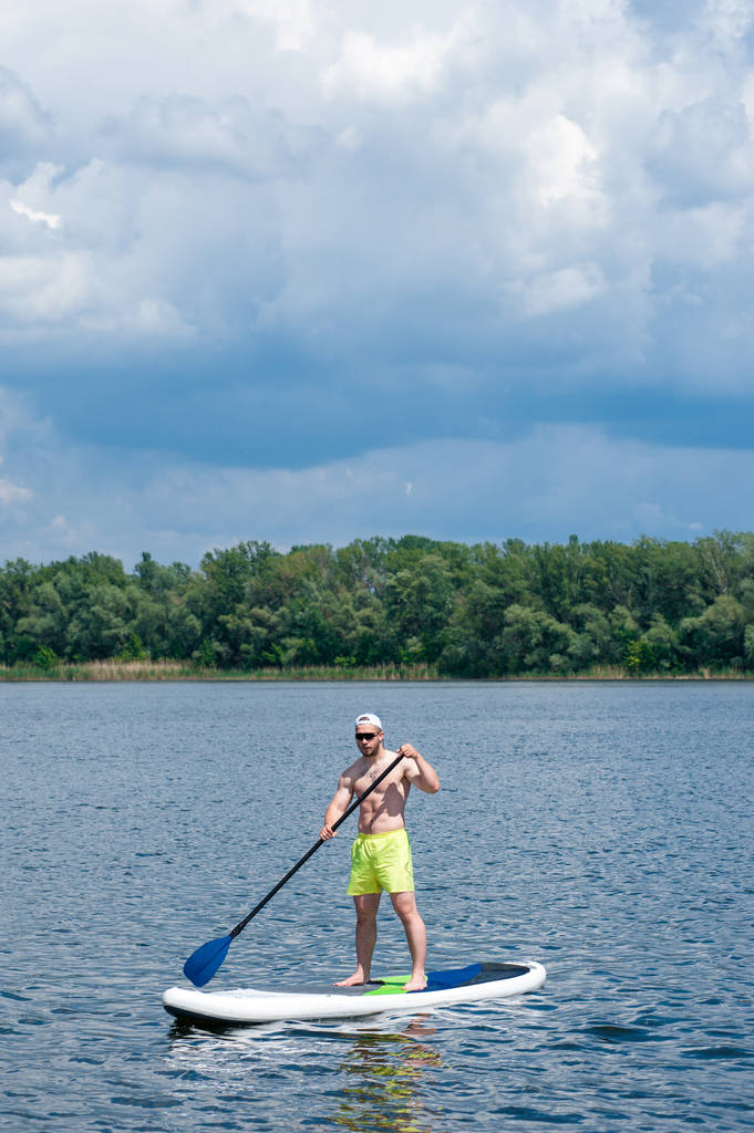 man practicing paddle board 04 - Photo, Image