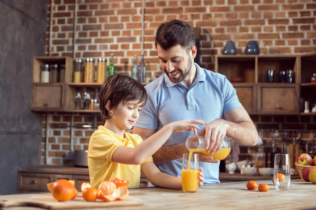 Father and son drinking juice - Photo, Image
