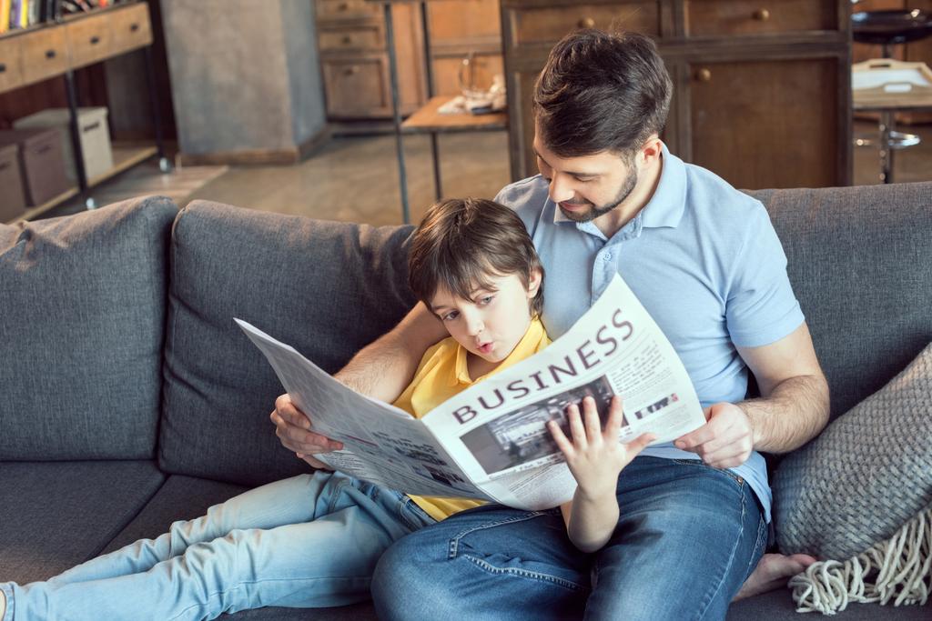 father and son reading newspaper - Photo, Image