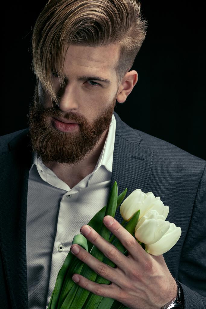 hombre con estilo con tulipanes
 - Foto, Imagen