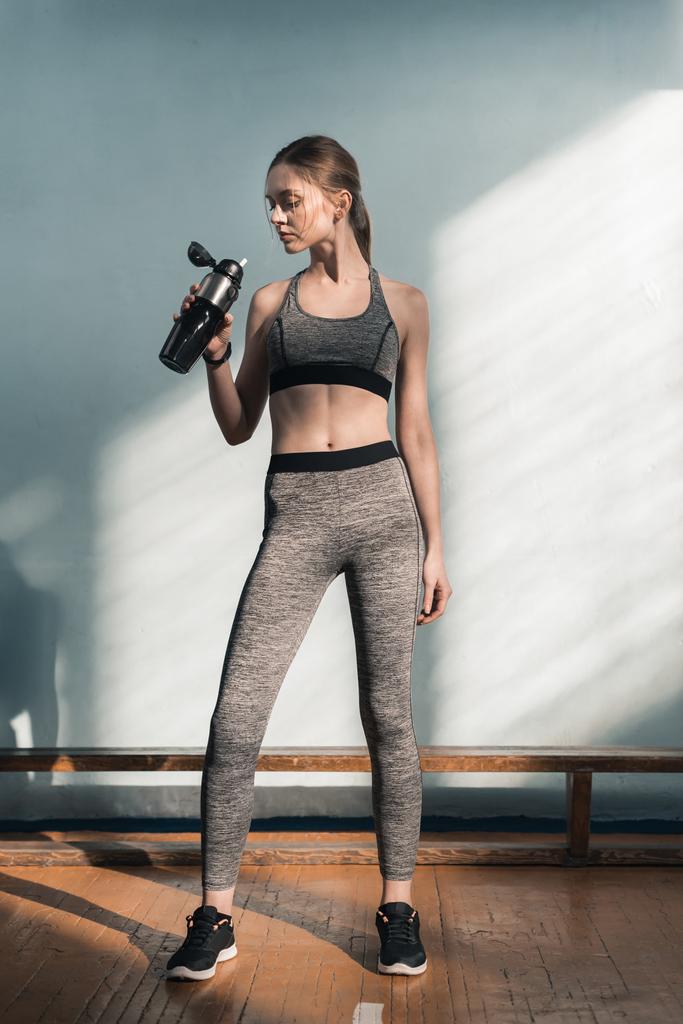sporty woman with bottle of water - Photo, Image