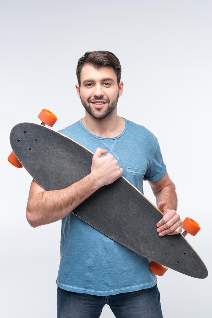 Молодий чоловік зі скейтбордом
 - Фото, зображення