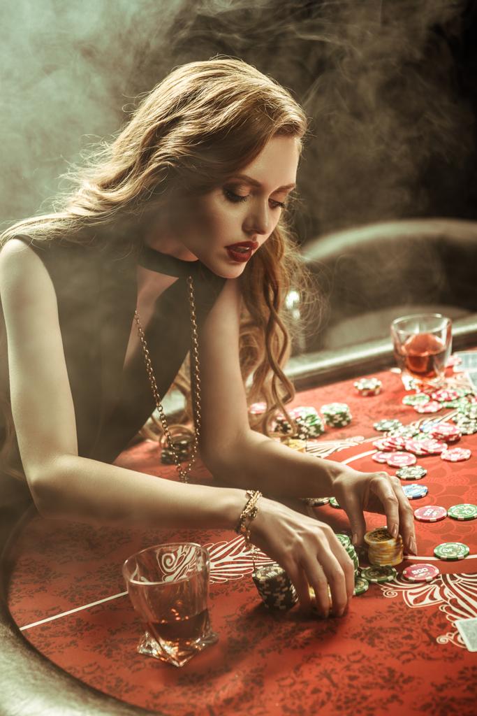 woman with poker chips - Photo, Image