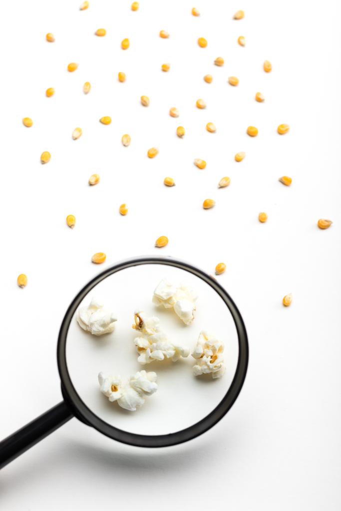 popcorn and magnifying glass - Photo, Image