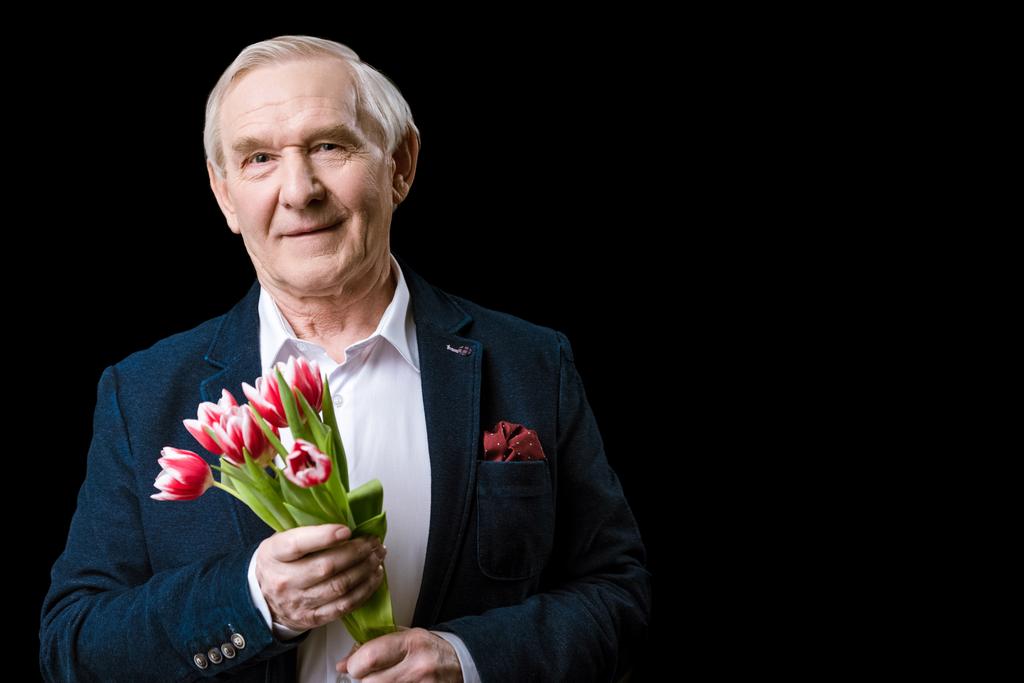 Старший чоловік з тюльпанами
 - Фото, зображення