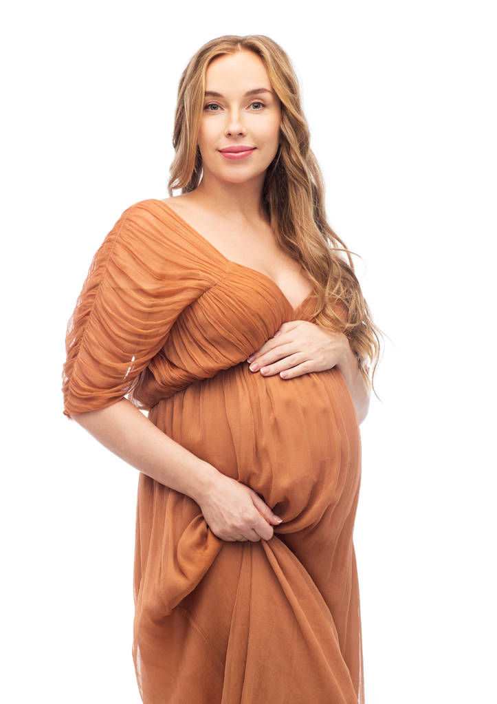 mulher grávida feliz tocando sua barriga grande
 - Foto, Imagem