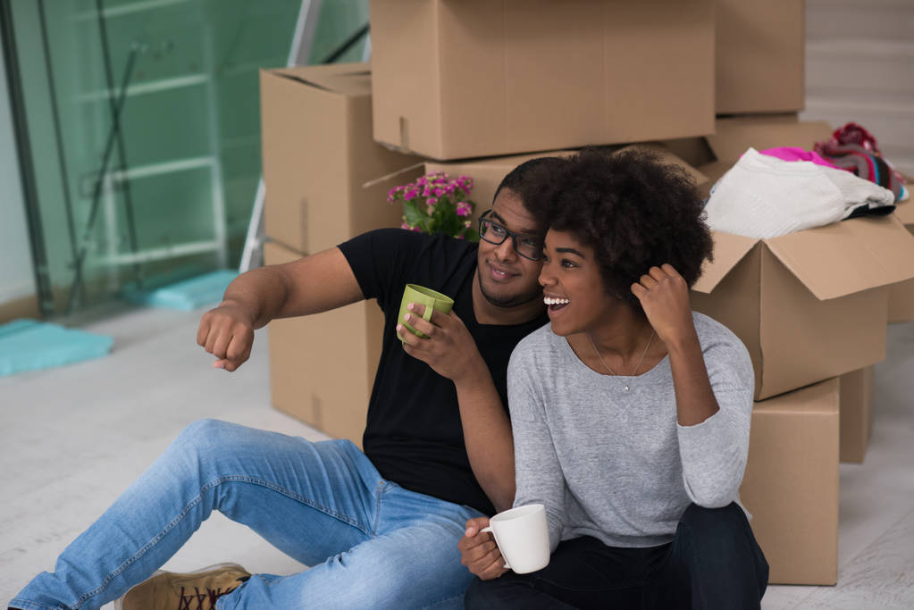 African American couple relaxing in new house - Photo, Image