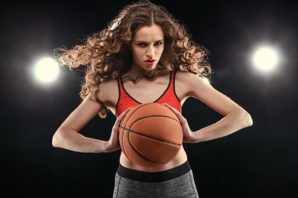 Sporty woman with basketball ball  - Photo, Image