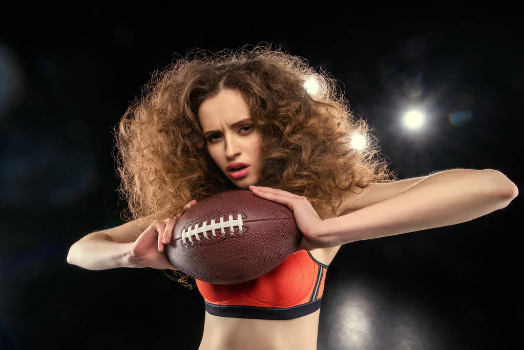 Woman holding rugby ball  - Photo, Image
