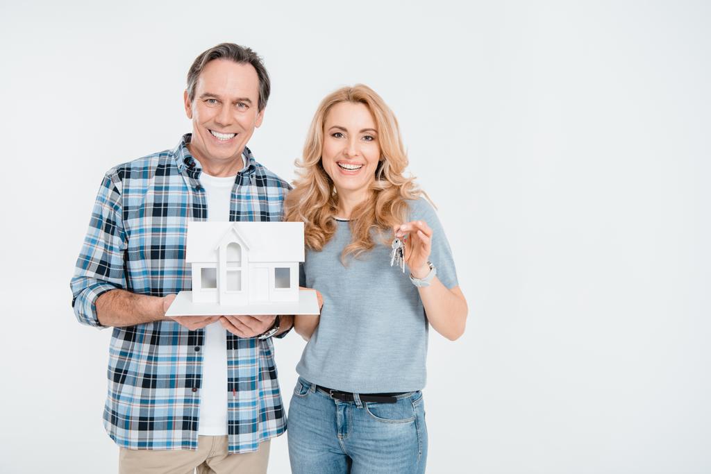 Couple holding house model - Photo, Image