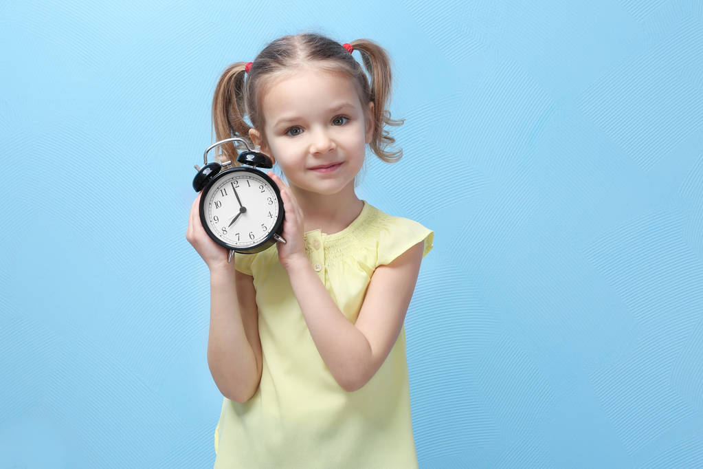 little girl with alarm clock  - Photo, Image