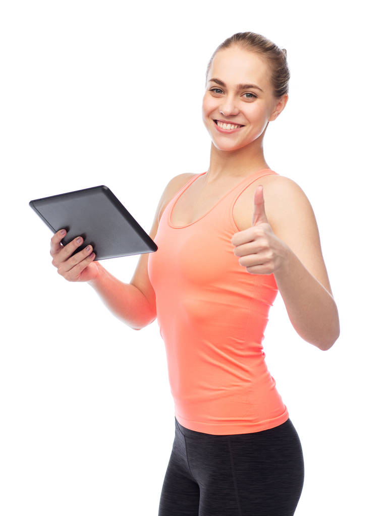 ευτυχής χαμογελαστοί sportive νεαρή γυναίκα με το tablet pc - Φωτογραφία, εικόνα