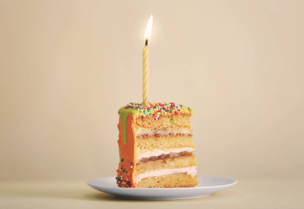 Slice of birthday cake with candle  - Photo, Image
