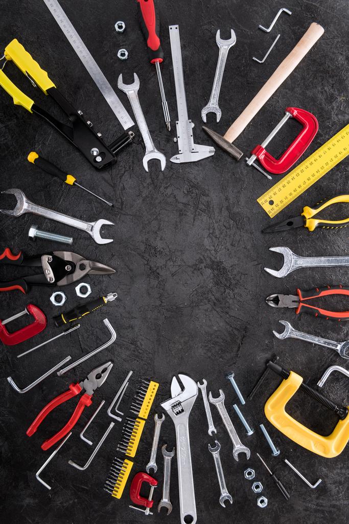 Top view of set of construction tools on black background - Photo, Image