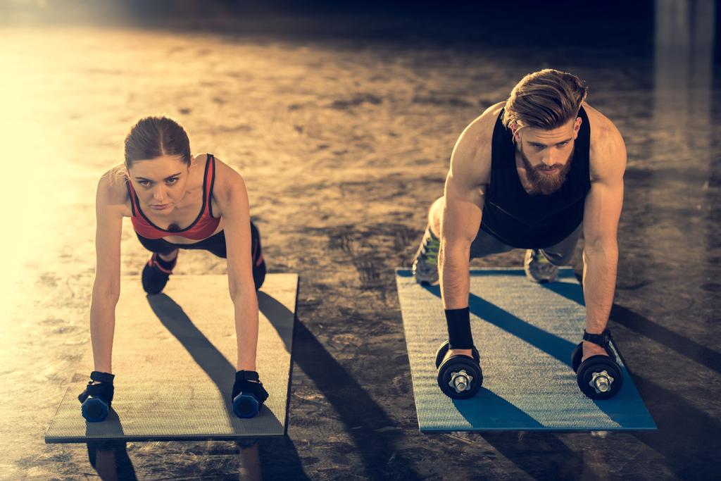 Man and woman doing plank exercise  - Photo, Image