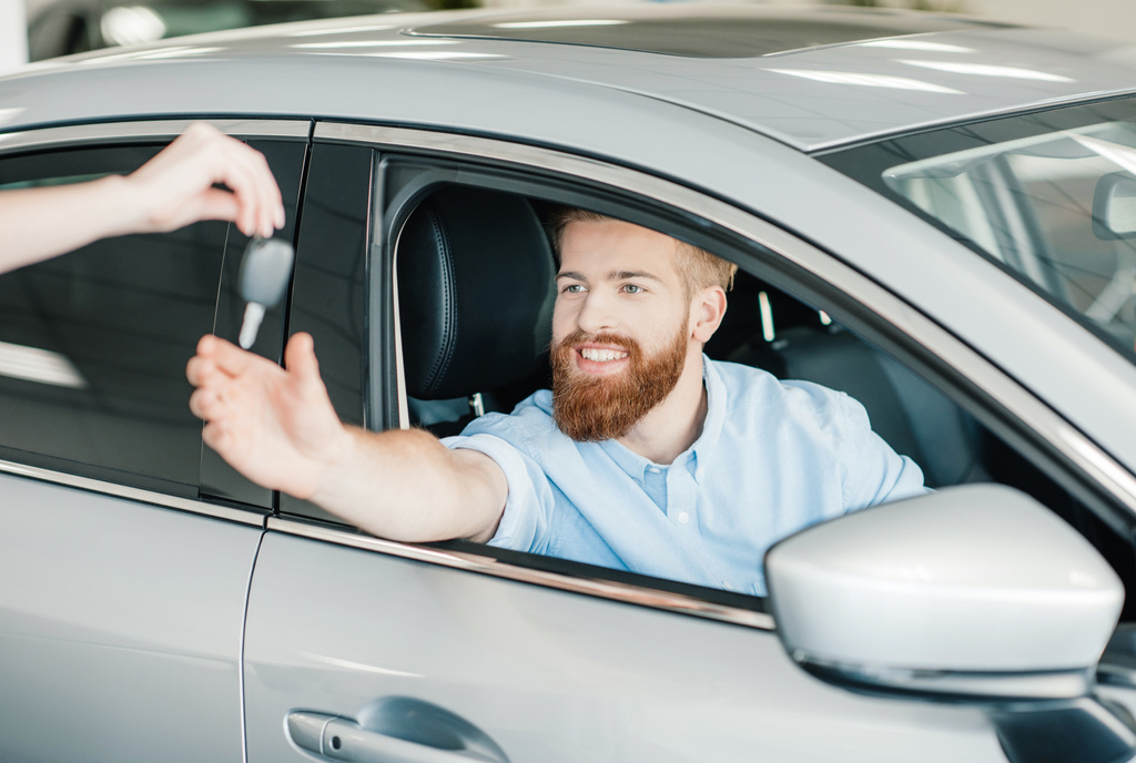 Man sitting in new car  - Photo, Image