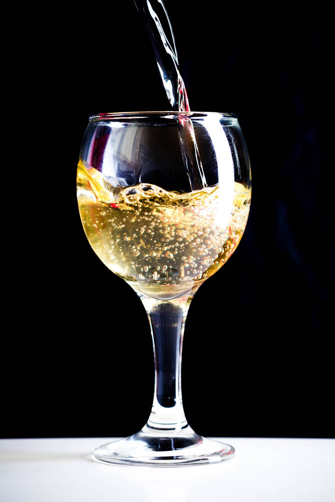 White wine pouring into glass - Photo, Image