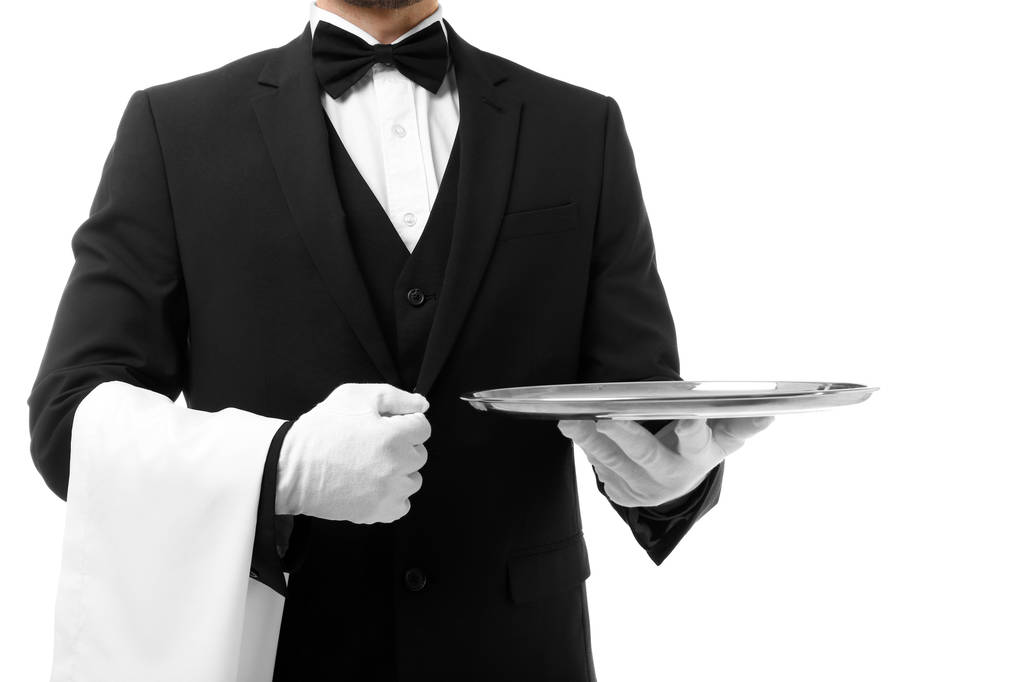 Knappe kelner met metalen lade op witte achtergrond, close-up - Foto, afbeelding