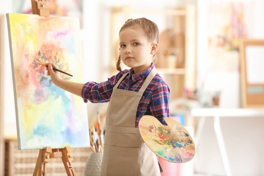 Cute little artist painting picture in studio - Photo, Image