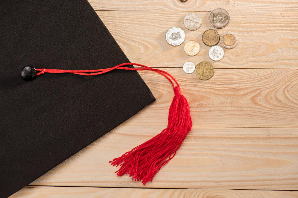 Graduation mortarboard and coins  - Photo, Image