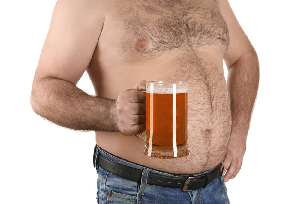 Чоловік з великим животом тримає келих пива
  - Фото, зображення
