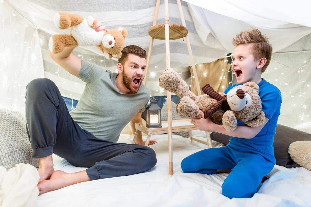 Father and son in blanket fort  - Photo, Image