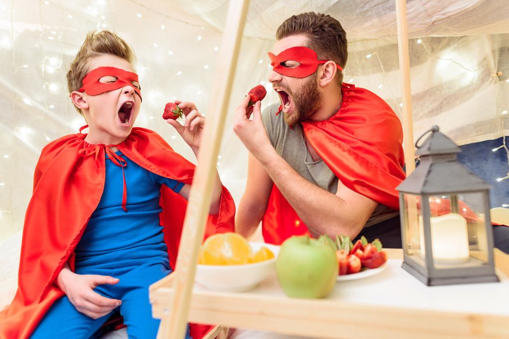 Father and son in superhero costumes  - Photo, Image