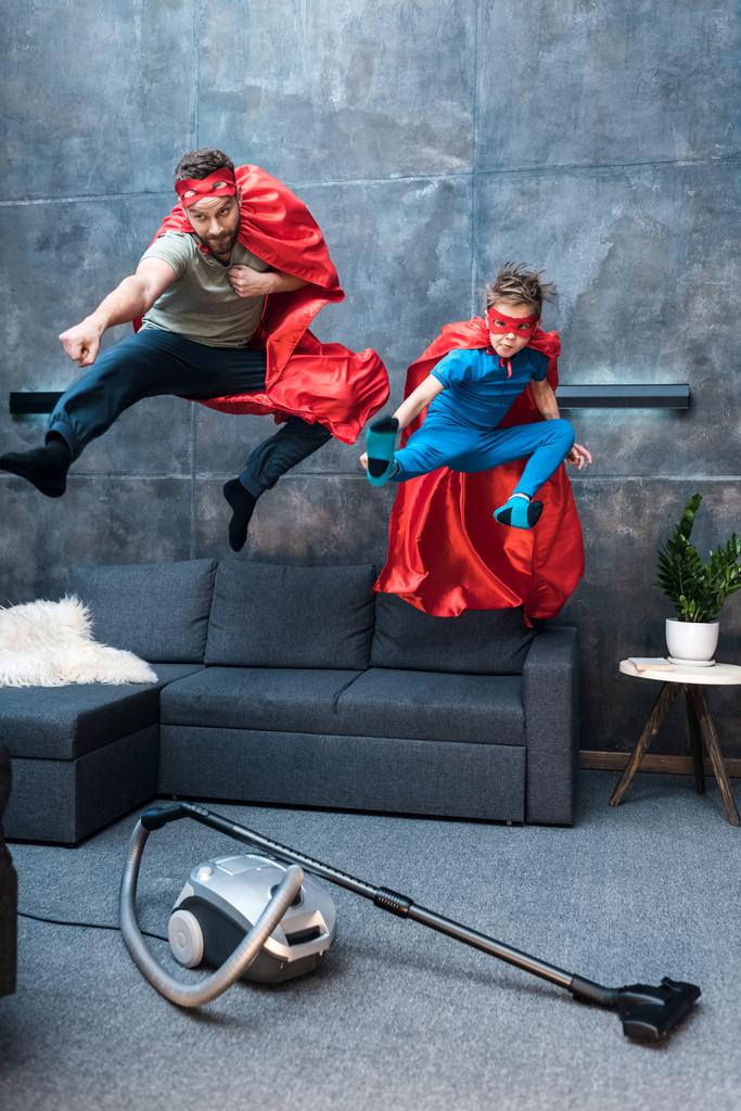 father and son in superhero costumes - Photo, Image