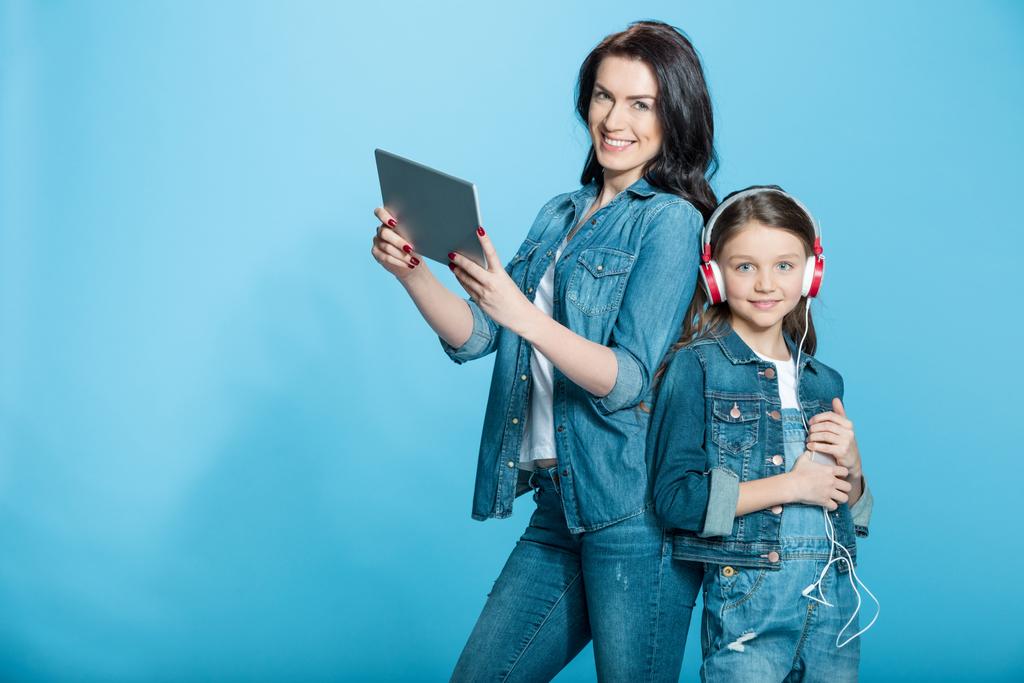 mother and daughter with digital tablet  - Photo, Image