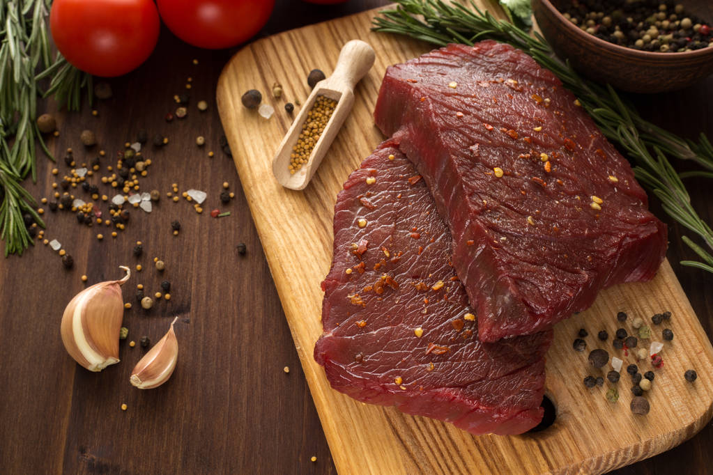 raw beef steak with ingredients for cooking - Photo, Image