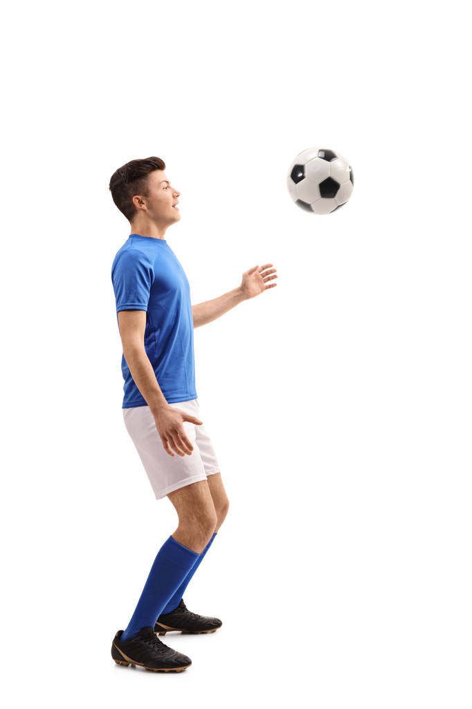 Jogador de futebol adolescente com um futebol
 - Foto, Imagem