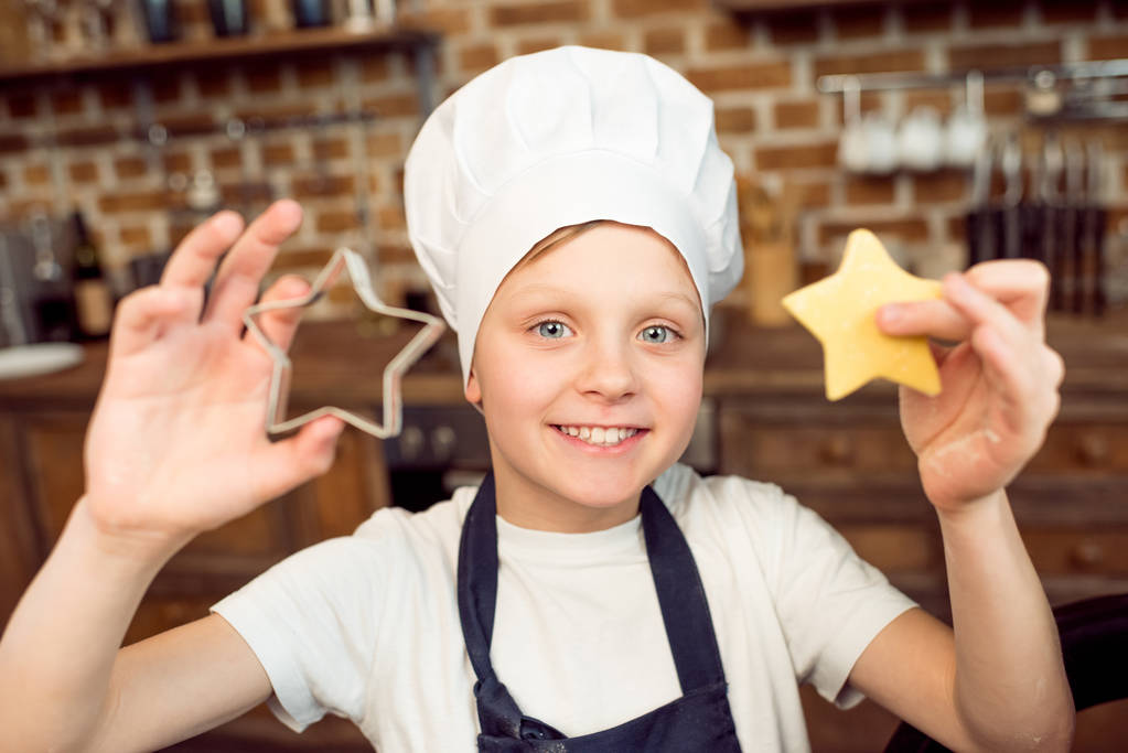 boy holding raw dough - Photo, Image