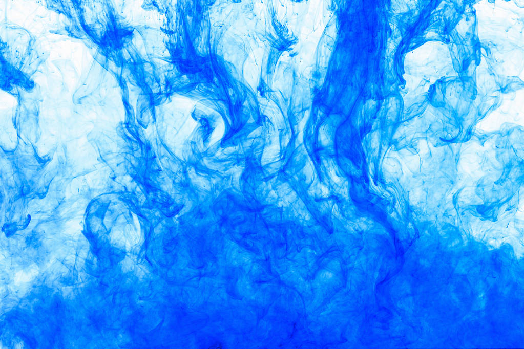 Sfondo astratto. Inchiostro blu in acqua, in movimento. Goccia di colore vorticoso. Nuvola colorata di vernice su bianco
. - Foto, immagini
