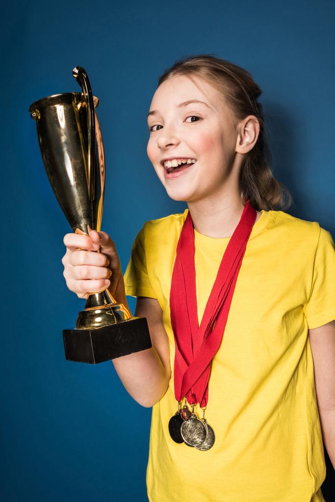 girl with medals and trophy  - Photo, Image