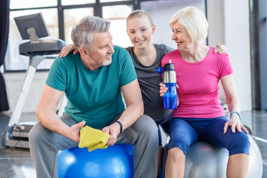 Old couple with girl in gym  - Photo, Image