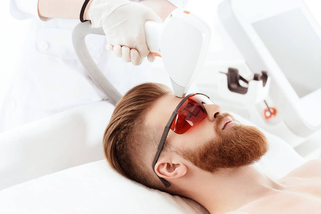 man receiving laser skin care - Photo, Image