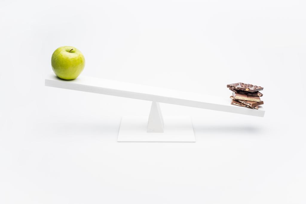 Manzana y chocolate en balancín
  - Foto, imagen