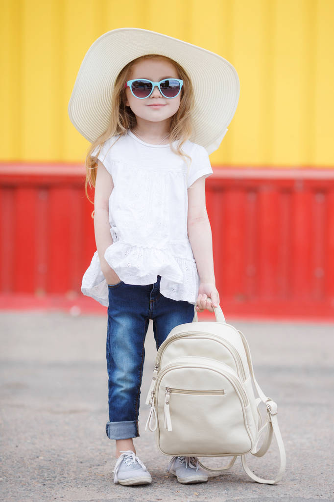 Little schoolgirl with a white backpack - Photo, Image