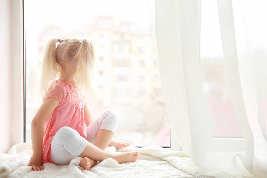 girl sitting on windowsill - Photo, Image