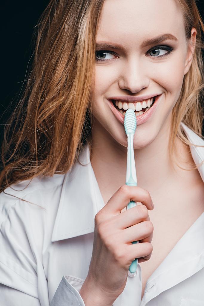 woman in male shirt brushing teeth - Photo, Image