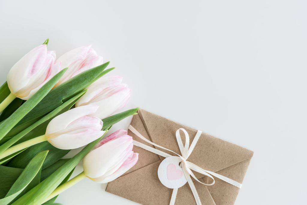 light pink tulips and envelope  - Photo, Image