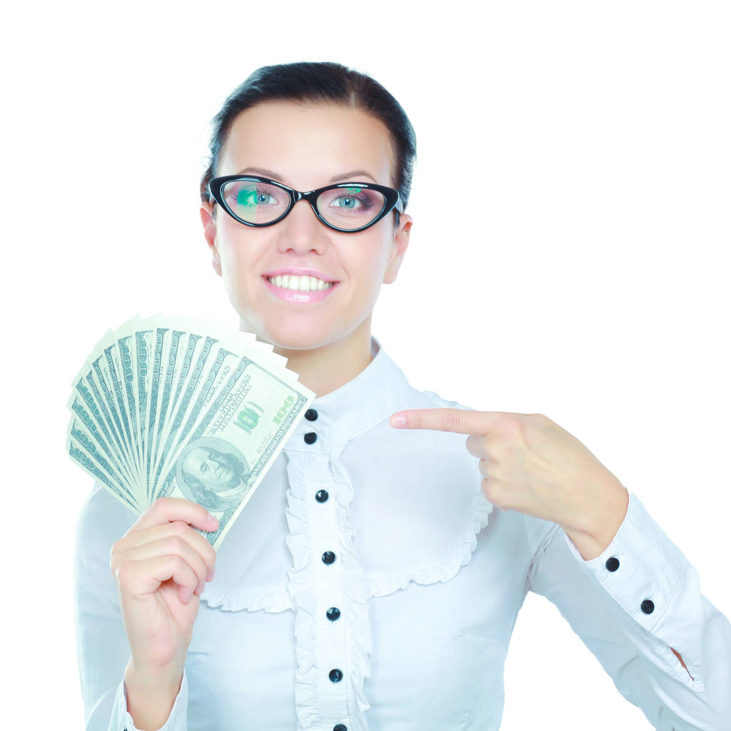 Una joven con dólares en las manos, aislada sobre fondo blanco
 - Foto, imagen