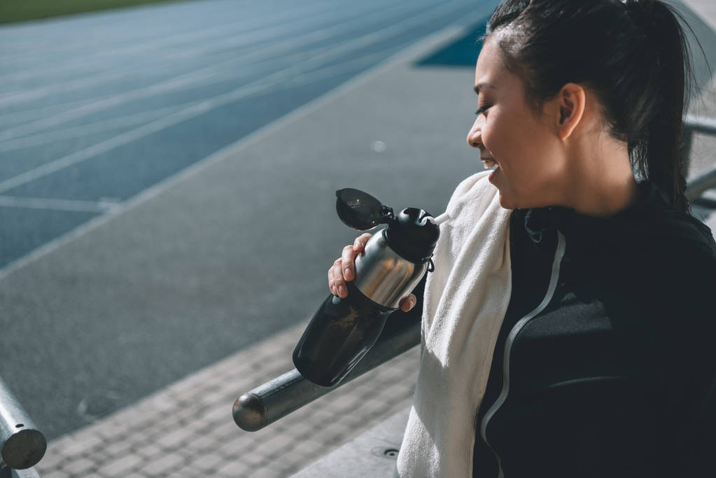 sportswoman with sport bottle - Photo, Image