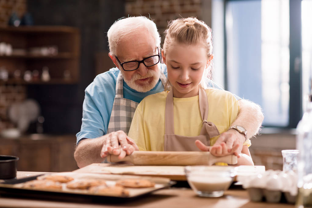 grandfather and granddaughter making dough - Photo, Image