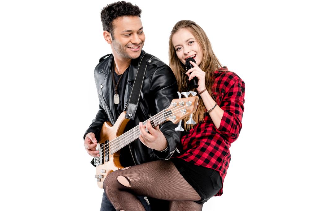 Echtpaar met microfoon en gitaar  - Foto, afbeelding