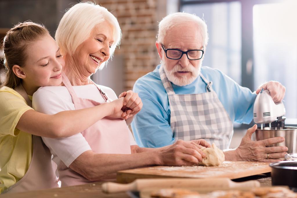 Family kneading dough  - Photo, Image