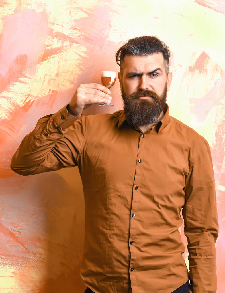 Brutal caucasian hipster holding alcoholic shot - Photo, Image