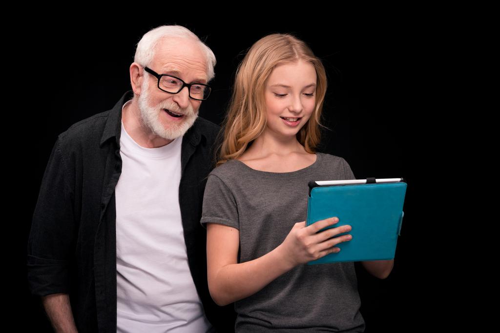 Grandfather and granddaughter with digital tablet  - Photo, Image
